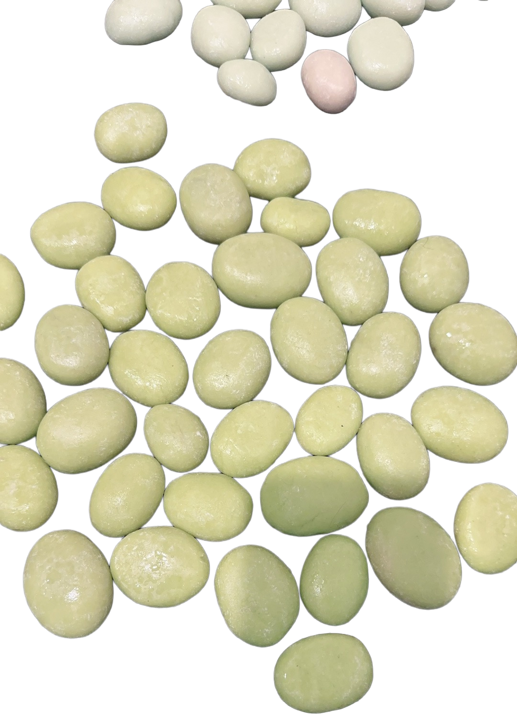 Close-up collection of smooth polished stones in soft shades of pale green, cream, beige, and white arranged together.