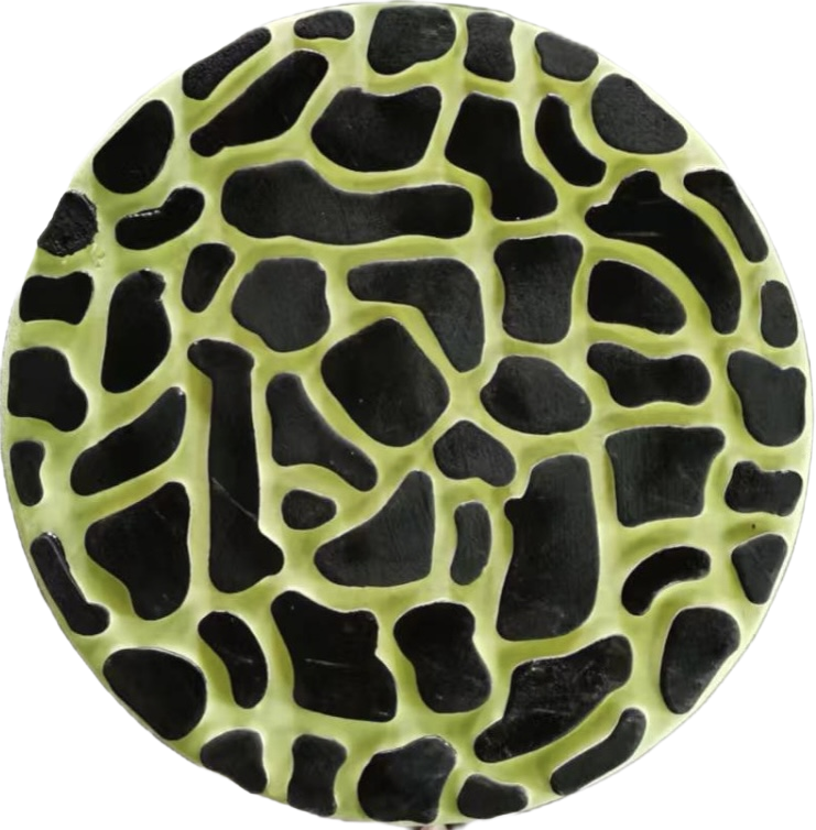 Yellow glow-in-the-dark decorative garden stepping stone with cracked mosaic pattern