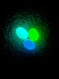 Blue and green glow-in-the-dark decorative garden stones